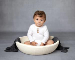 Baby boy in bowl during baby photography session Glasgow
