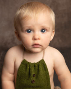 boy wearing green baby photography session