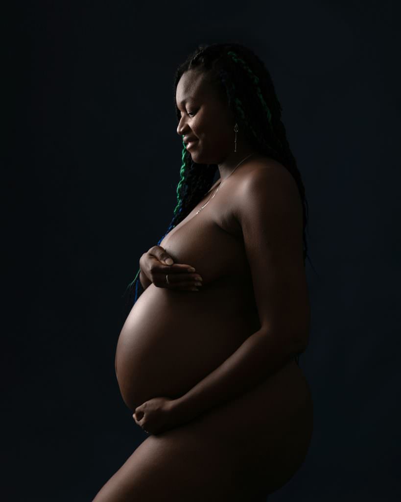 Naked female pregnant silhouette shot