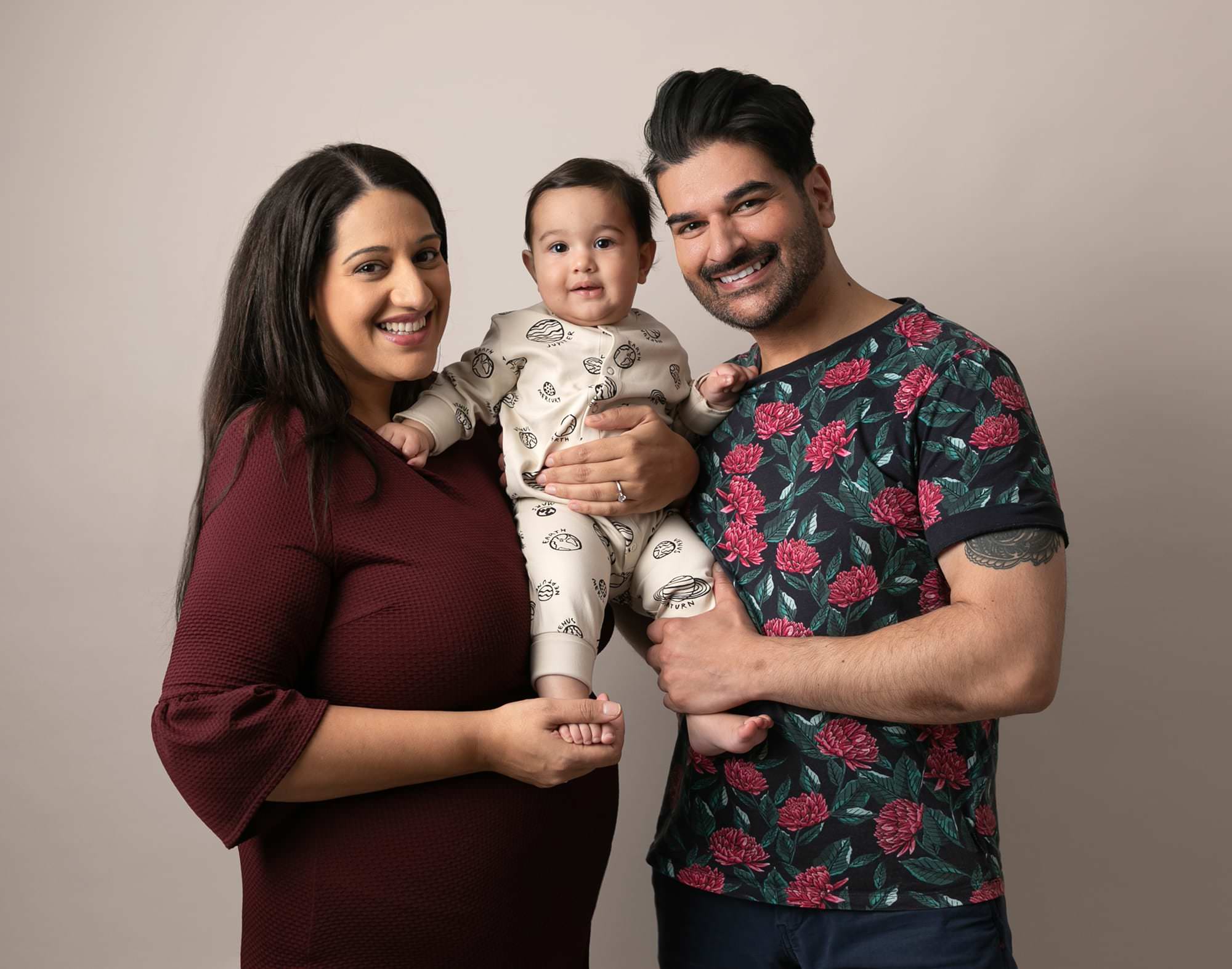 Baby boy with both parents at photoshoot